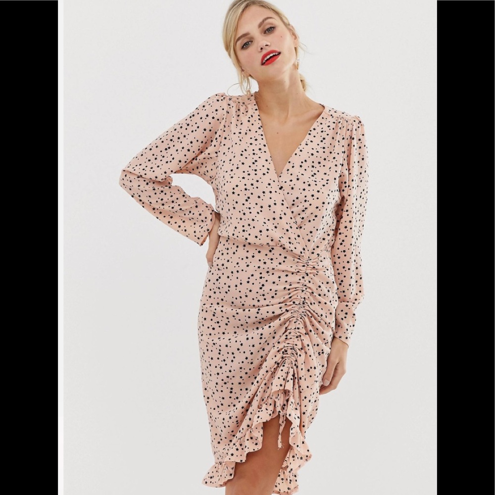 Wrap dress with ruffle hem in star print